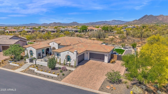 aerial perspective of suburban area featuring a mountain backdrop