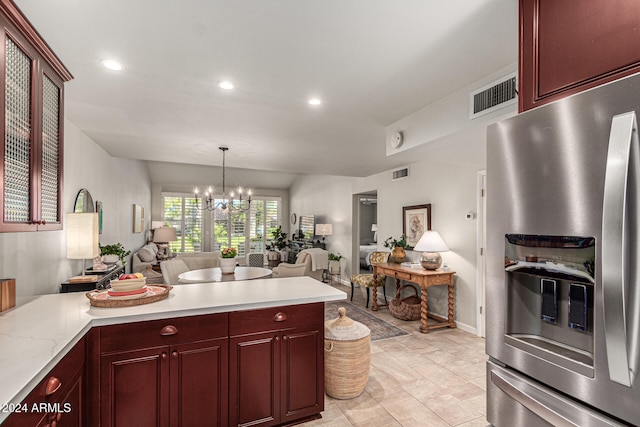 kitchen featuring decorative light fixtures, a chandelier, and stainless steel fridge with ice dispenser