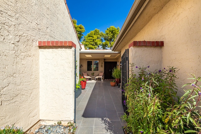 entrance to property featuring a patio area