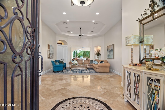 entryway featuring a raised ceiling