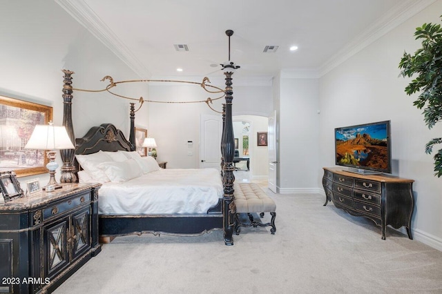 bedroom featuring crown molding and light carpet