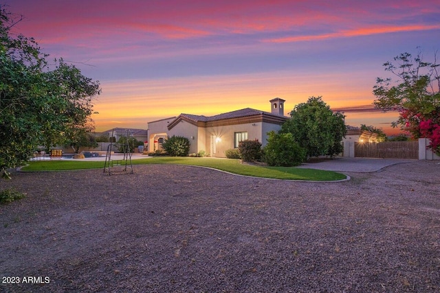 view of front of property with a lawn