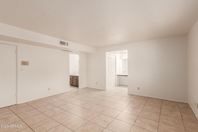 8027 N 32nd Ave, Phoenix, AZ 85051 - unfurnished room with light tile patterned floors