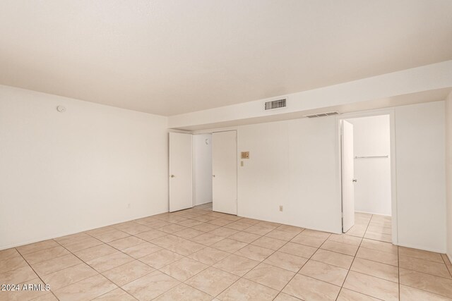 spare room with light tile patterned floors