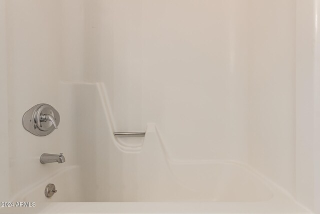 interior details featuring shower / bathing tub combination