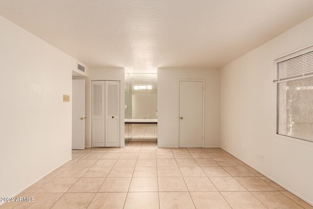 view of tiled spare room