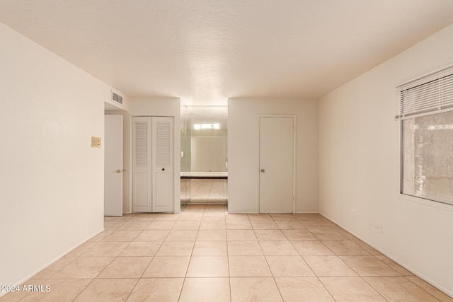 8027 N 32nd Ave, Phoenix, AZ 85051 - unfurnished room with light tile patterned floors