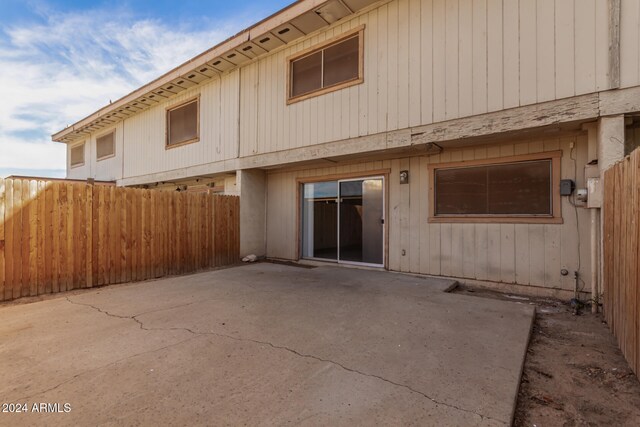 back of property with a patio area