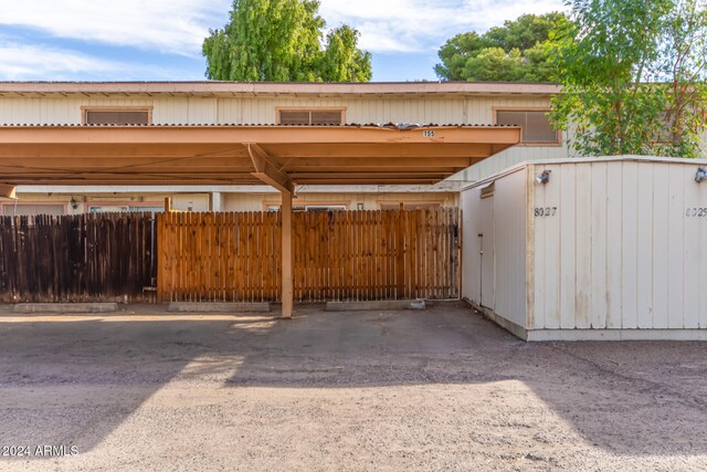 view of vehicle parking with a carport