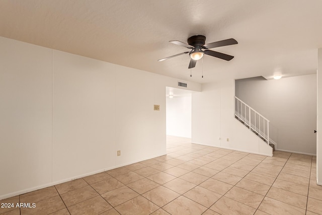 8027 N 32nd Ave, Phoenix, AZ 85051 - empty room featuring stairs, ceiling fan, and light tile patterned floors