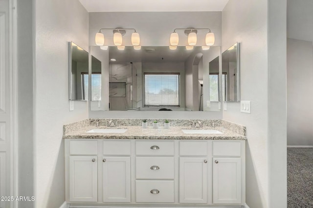 bathroom featuring vanity and a shower