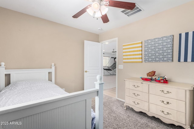 bedroom featuring ceiling fan and light carpet