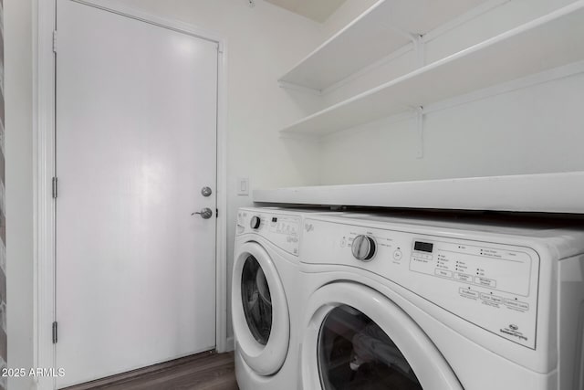 washroom with dark hardwood / wood-style flooring and separate washer and dryer