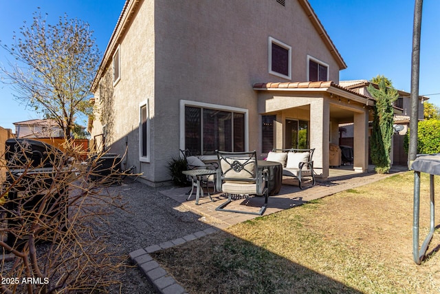 back of house with a patio