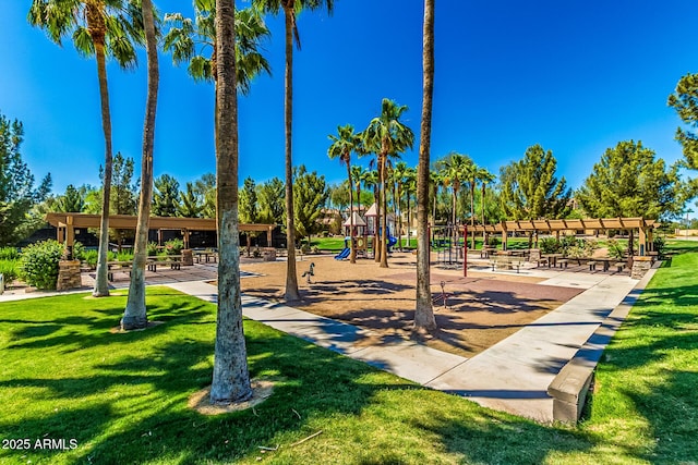 view of play area with a yard and a pergola