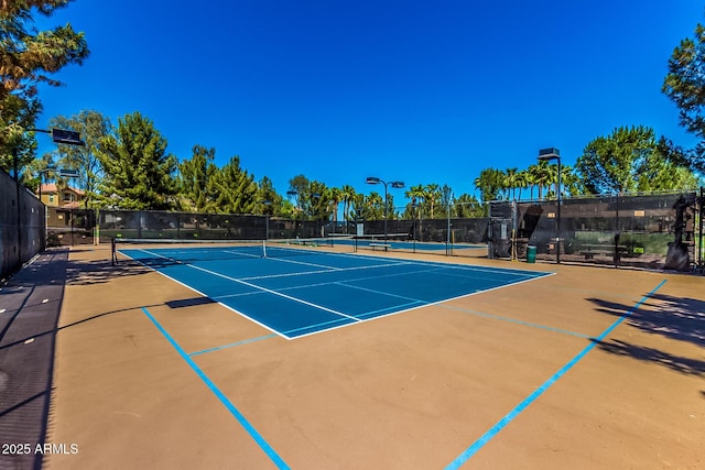 view of sport court featuring basketball hoop