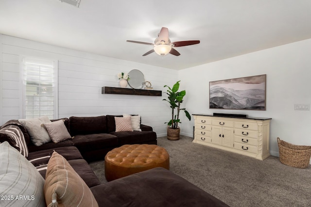 living room featuring carpet flooring and ceiling fan