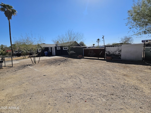 ranch-style house with fence