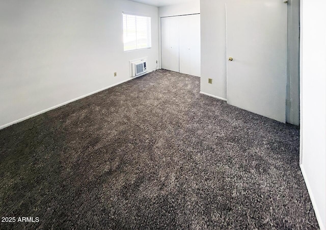 unfurnished bedroom featuring dark carpet