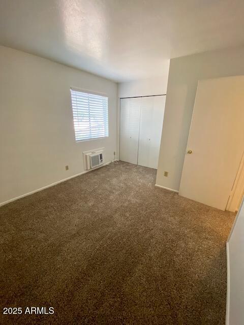 interior space featuring an AC wall unit