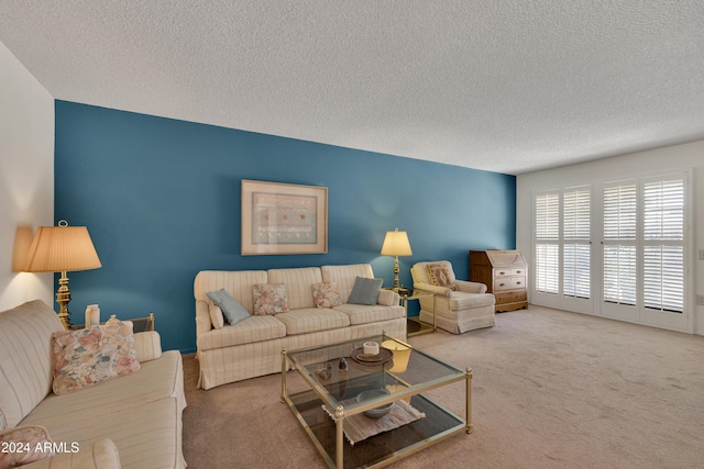 living room featuring carpet flooring and a textured ceiling