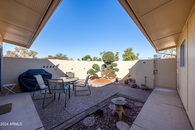 view of patio / terrace featuring area for grilling and central air condition unit