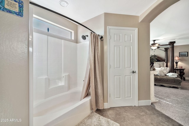 bathroom with shower / tub combo with curtain and ceiling fan