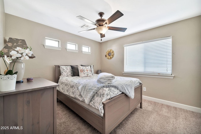 bedroom featuring light colored carpet and ceiling fan