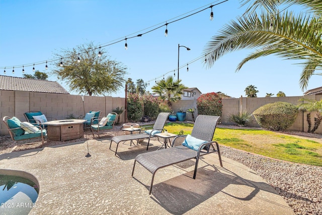 view of patio / terrace featuring a fire pit