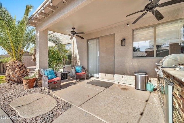 view of patio featuring ceiling fan