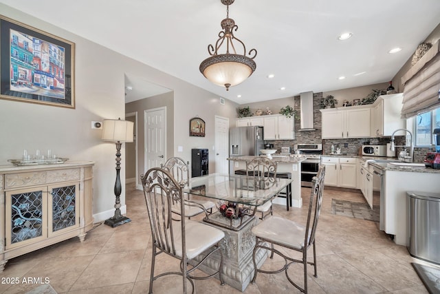 tiled dining room with sink