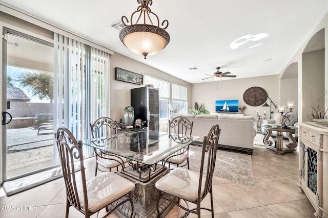 tiled dining room with ceiling fan