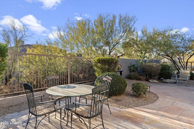 wooden deck with a patio