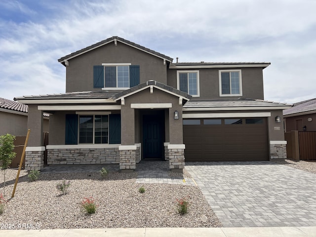 40531 W Rio Grande Dr, Maricopa, AZ 85138 - view of front of property with stone siding, stucco siding, decorative driveway, and an attached garage