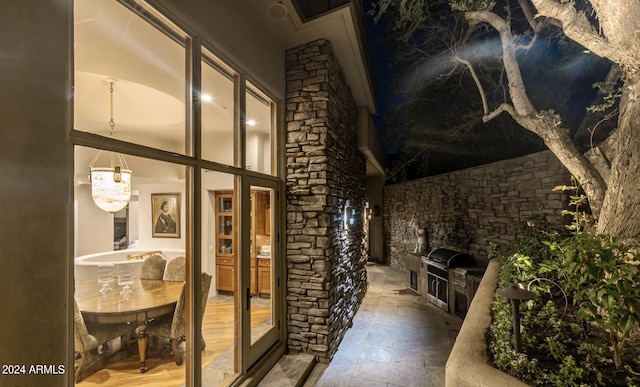 interior space with grilling area and an outdoor kitchen