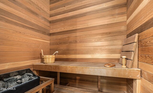 view of sauna / steam room featuring wood walls