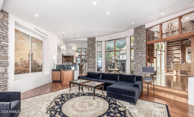 living room featuring hardwood / wood-style floors and a chandelier