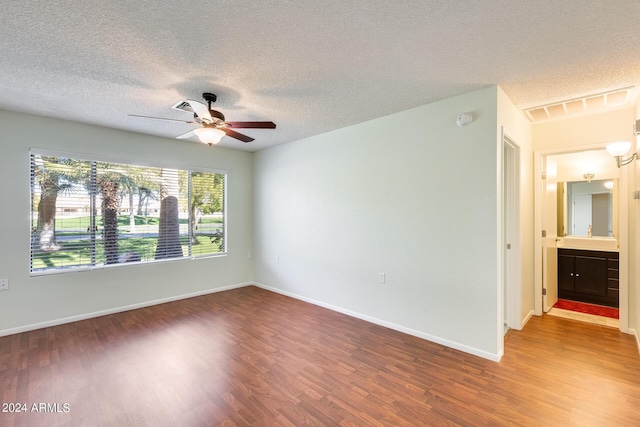 14300 W Bell Rd Unit 35, Surprise, AZ 85374 - empty room featuring baseboards, ceiling fan, visible vents, and wood finished floors