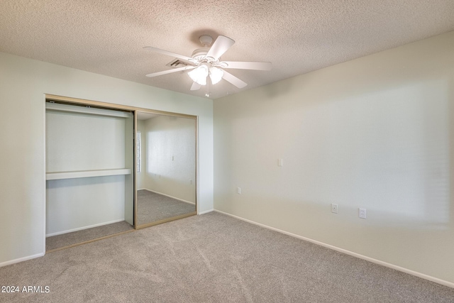 14300 W Bell Rd Unit 35, Surprise, AZ 85374 - unfurnished bedroom with carpet, baseboards, a textured ceiling, a ceiling fan, and a closet