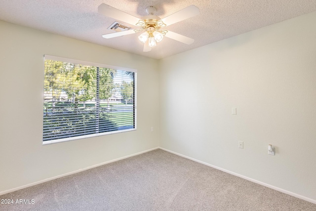 14300 W Bell Rd Unit 35, Surprise, AZ 85374 - empty room with baseboards, carpet floors, and a textured ceiling
