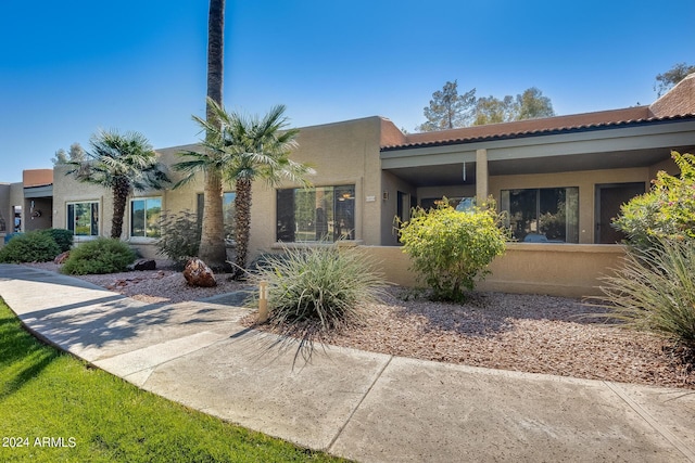 14300 W Bell Rd Unit 35, Surprise, AZ 85374 - view of front facade featuring stucco siding and a tiled roof