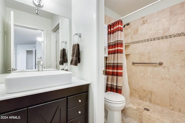 14300 W Bell Rd Unit 35, Surprise, AZ 85374 - full bathroom featuring toilet, vanity, and a tile shower