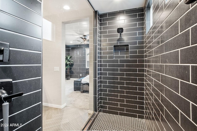 bathroom featuring ceiling fan and tile patterned flooring