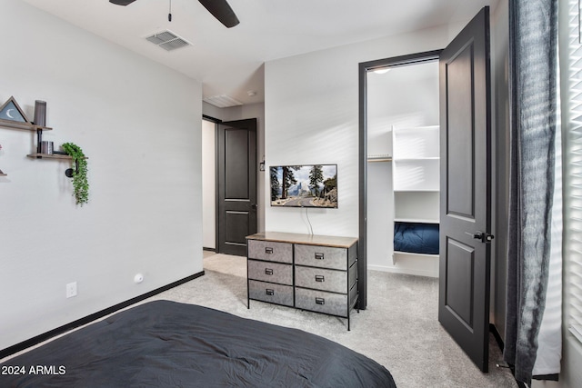 bedroom featuring ceiling fan and light carpet