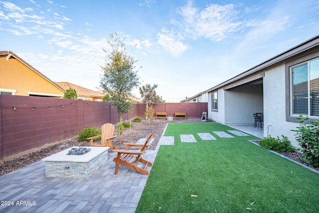 view of yard with a patio area and a fire pit