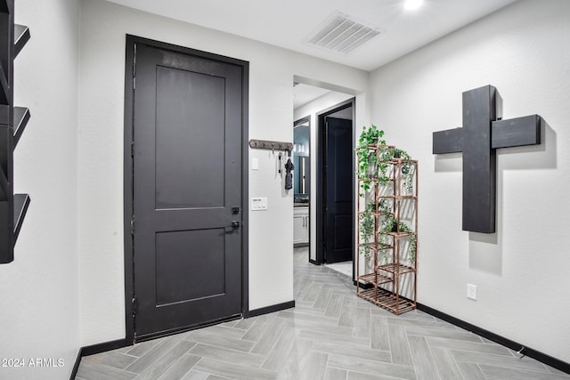 foyer entrance with light parquet floors