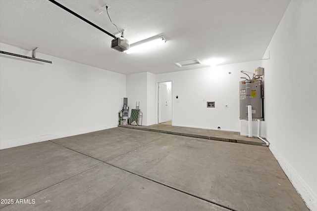 garage featuring electric water heater and a garage door opener