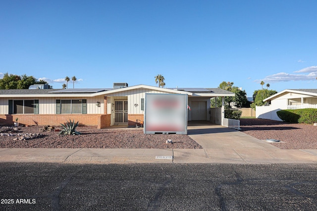 view of front of home featuring solar panels