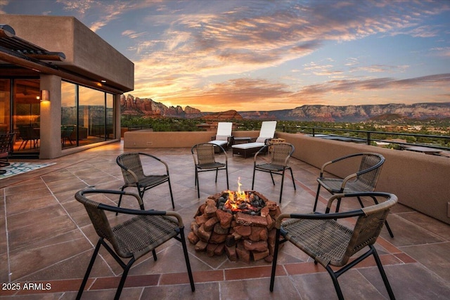 patio terrace at dusk with a mountain view