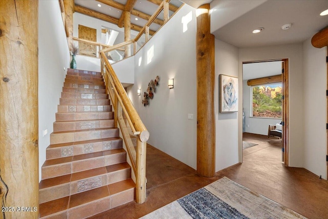 stairs featuring concrete floors